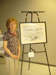 Helen Devereux beside her graduation painting