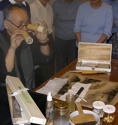 Bamboo containers used to spread gold flakes