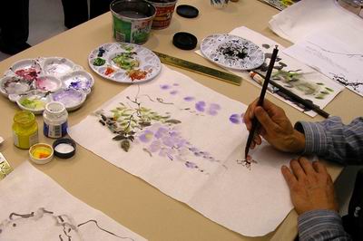 A butterfly is added to bring in another element to the painting