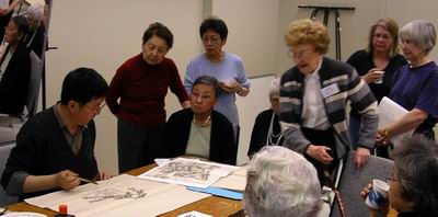 Participants return to watch the completion of the landscape