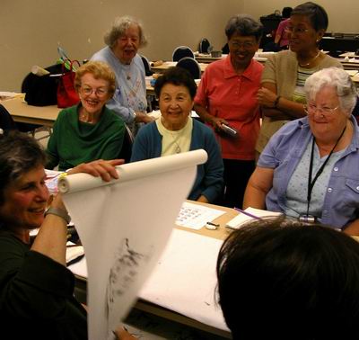 Workshop participants look at tiger