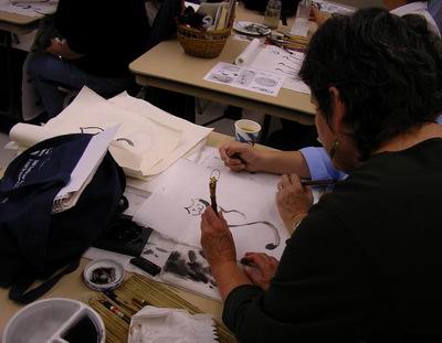 Roslyn Levin working one on one with a workshop participant