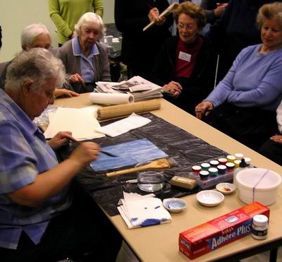 Colour of treated paper added