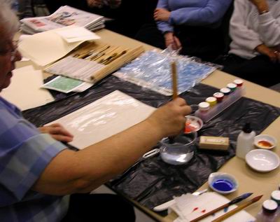 Hake brush used to wet non-absorbent paper