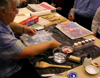 Taking off saran wrap from first treated paper