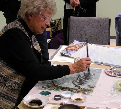 Branches and leaves fill our painting on treated paper