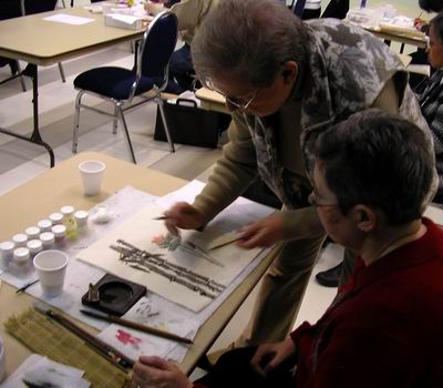 Explaining shading technique to workshop participant