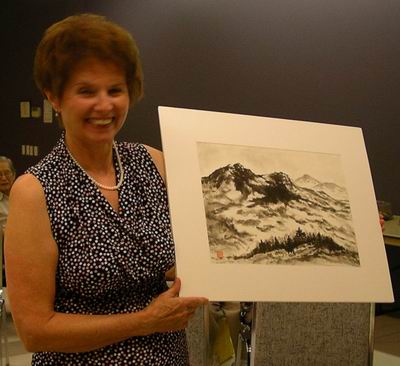 Leona Kelly painting with her seal 